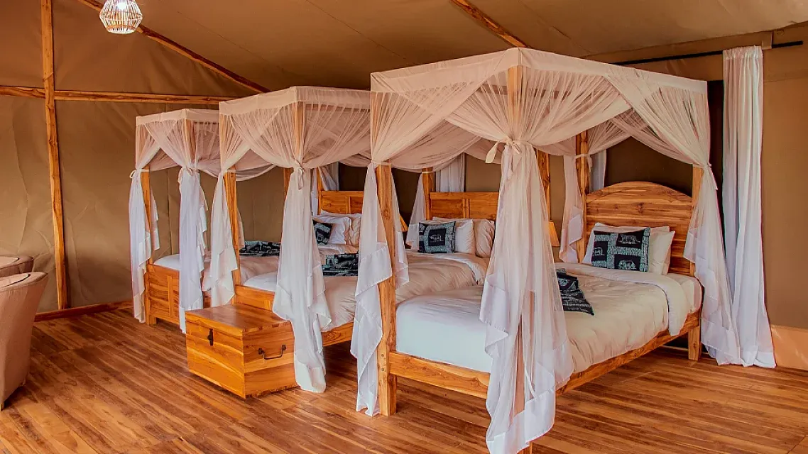Family safari tent with four beds at Land of Nature Camp