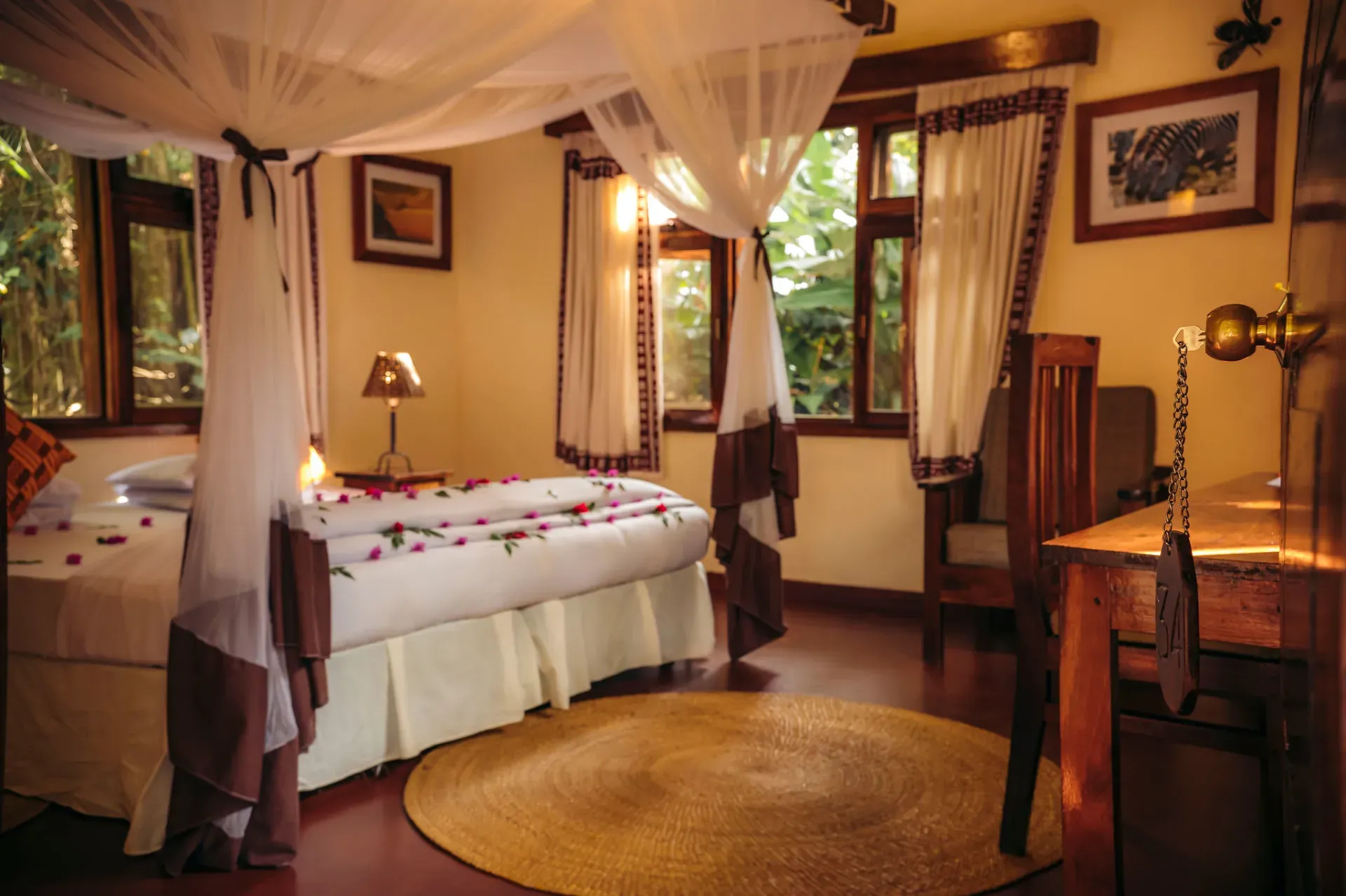 Cottage bedroom with canopy bed at Moivaro Lodge